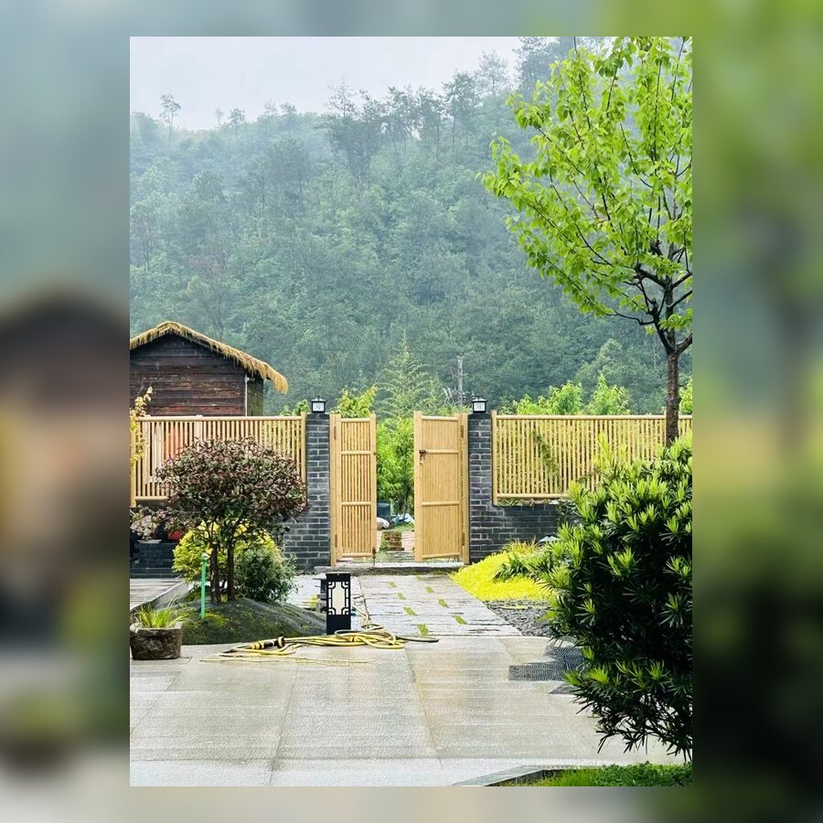 Aluminum bamboo privacy fence installation beside a walkway